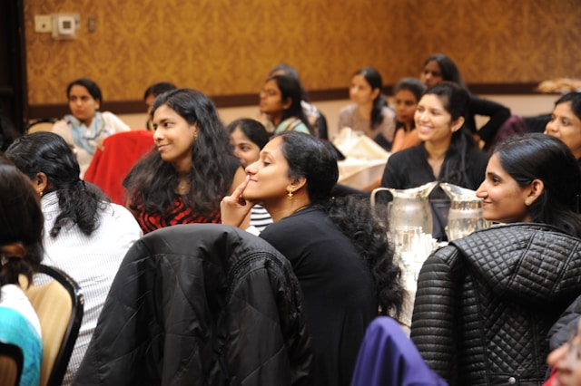 audience members laughing to a funny persuas